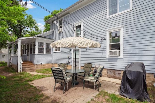 700 S Washington, Mount Pleasant, MI 48858 - view of patio featuring outdoor dining area, a sunroom, and grilling area