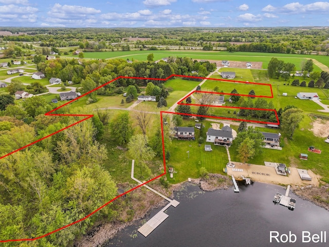 291 Sunset Dr, Sand Lake, MI 49343 - aerial view of property and surrounding area with property boundaries highlighted and a tree filled landscape