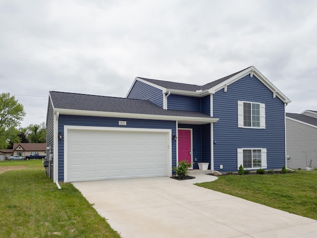 1925 Prescott Trl, Galesburg, MI 49053 - split level home featuring a front lawn, concrete driveway, an attached garage, and roof with shingles