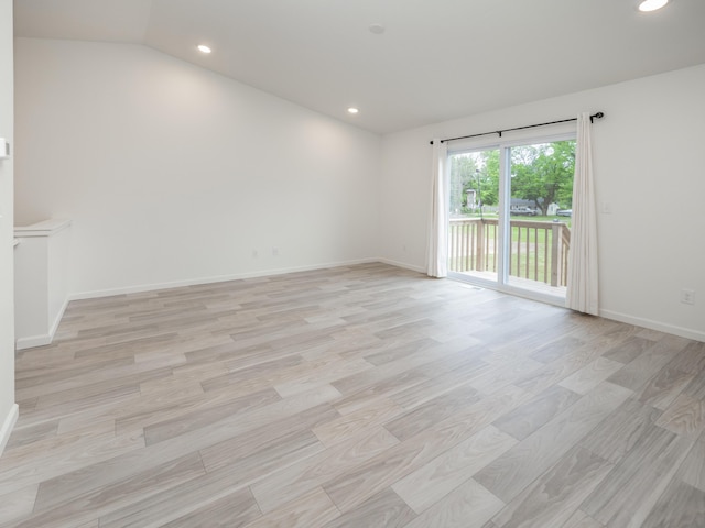 1925 Prescott Trl, Galesburg, MI 49053 - empty room with vaulted ceiling, baseboards, recessed lighting, and light wood-style flooring