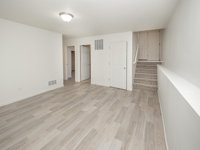 1925 Prescott Trl, Galesburg, MI 49053 - empty room with light wood-type flooring, stairway, and baseboards