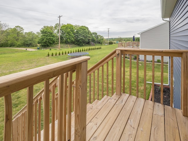 1925 Prescott Trl, Galesburg, MI 49053 - wooden deck featuring a lawn, a view of countryside, and a trampoline