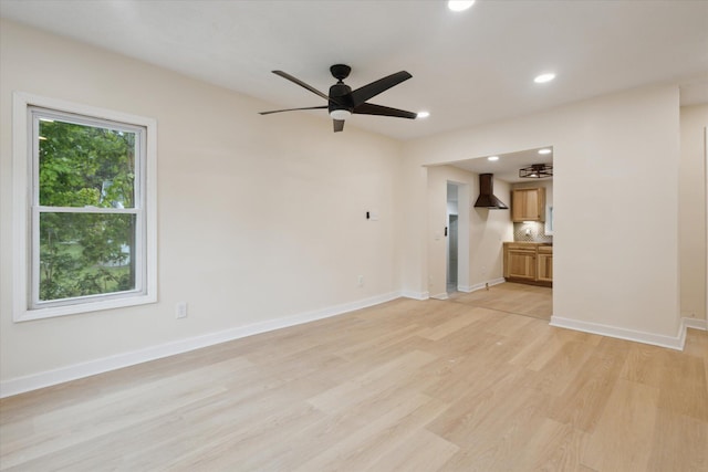 932 Enders Ave, Benton Harbor, MI 49022 - unfurnished living room with light wood-style floors, recessed lighting, a ceiling fan, and baseboards