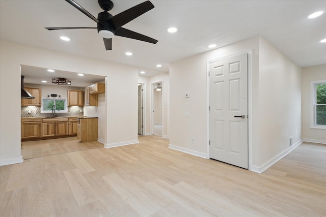 932 Enders Ave, Benton Harbor, MI 49022 - unfurnished living room featuring a sink, ceiling fan, light wood-style flooring, recessed lighting, and baseboards