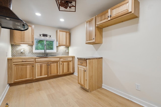 932 Enders Ave, Benton Harbor, MI 49022 - kitchen with ventilation hood, light wood-style floors, a sink, decorative backsplash, and baseboards
