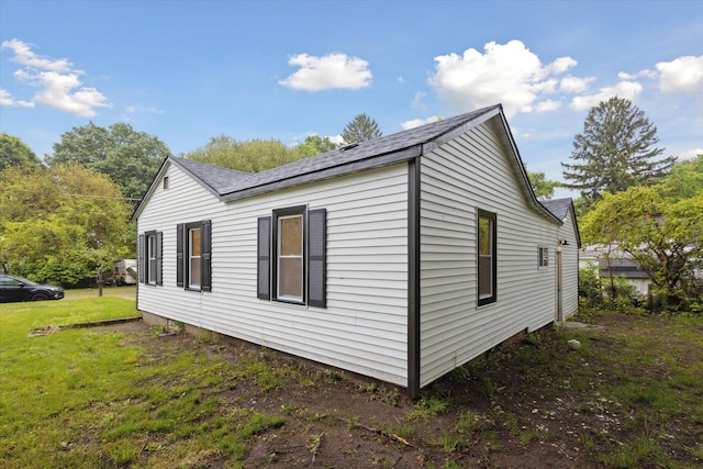 932 Enders Ave, Benton Harbor, MI 49022 - view of home's exterior with a shingled roof and a yard