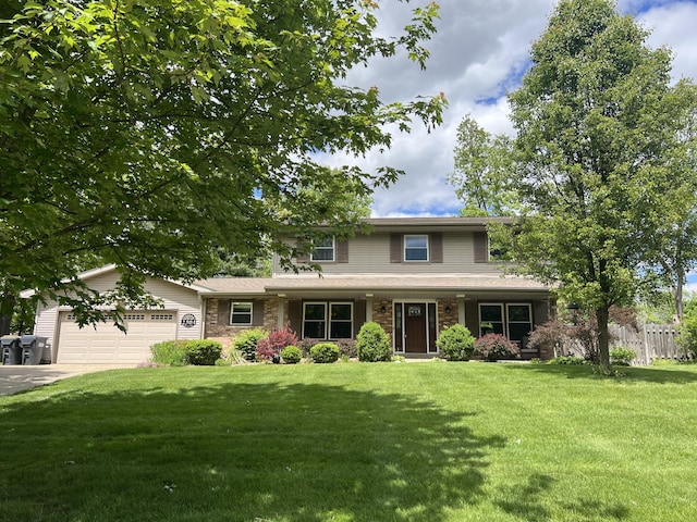 2304 Hickory Point Dr N, Portage, MI 49024 - traditional home with an attached garage, driveway, and a porch