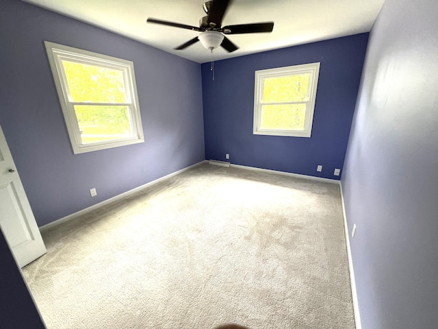 2304 Hickory Point Dr N, Portage, MI 49024 - unfurnished room with healthy amount of natural light, a ceiling fan, and carpet flooring