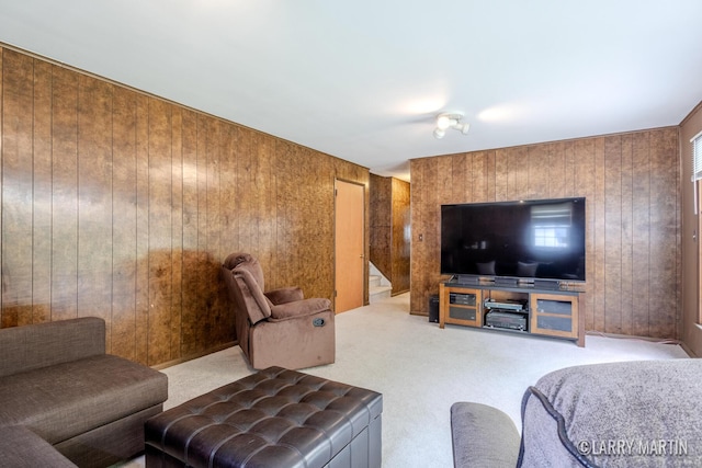 2153 Greenview Ct SW, Wyoming, MI 49519 - carpeted living room featuring wood walls and stairs