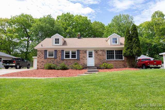 2153 Greenview Ct SW, Wyoming, MI 49519 - cape cod home featuring brick siding, a front lawn, a chimney, and a shingled roof