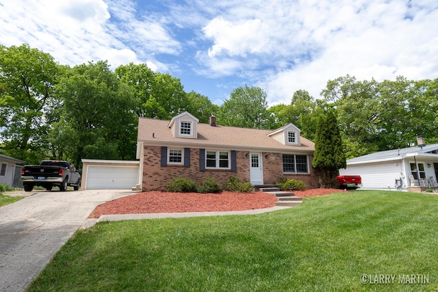 2153 Greenview Ct SW, Wyoming, MI 49519 - view of front facade with brick siding, a chimney, a front yard, a garage, and driveway