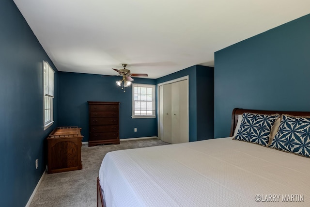2153 Greenview Ct SW, Wyoming, MI 49519 - carpeted bedroom with a closet, baseboards, and a ceiling fan