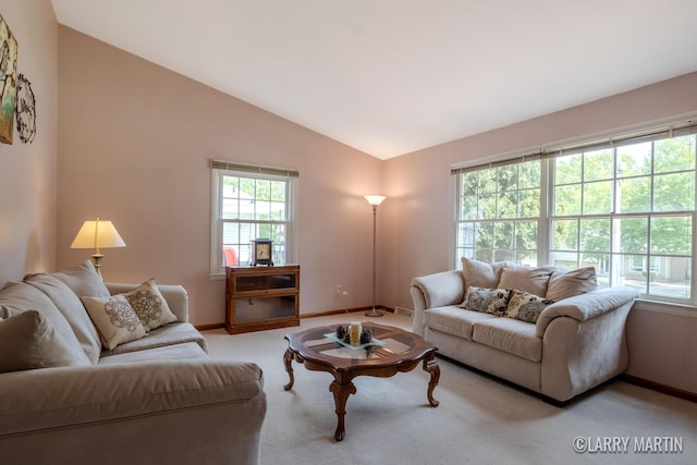 2153 Greenview Ct SW, Wyoming, MI 49519 - living area with vaulted ceiling, baseboards, and carpet