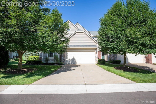 2062 Preserve Cir W, Canton, MI 48188 - obstructed view of property with concrete driveway, a front yard, and an attached garage