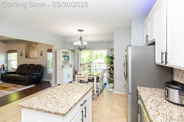 2062 Preserve Cir W, Canton, MI 48188 - kitchen with a chandelier, open floor plan, white cabinetry, and plenty of natural light