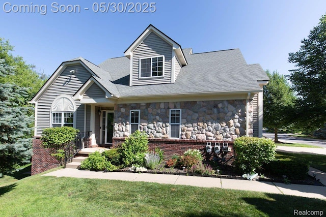 2062 Preserve Cir W, Canton, MI 48188 - view of front facade featuring stone siding, brick siding, a front yard, and a shingled roof