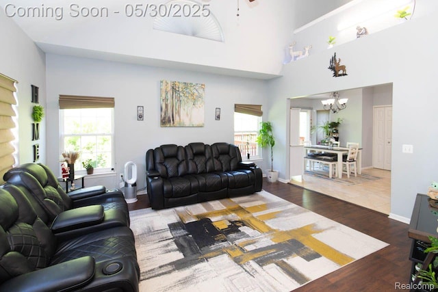 2062 Preserve Cir W, Canton, MI 48188 - living area with a chandelier, wood finished floors, plenty of natural light, and baseboards