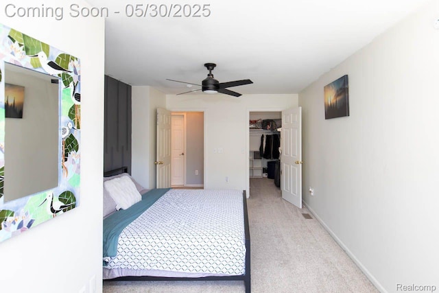 2062 Preserve Cir W, Canton, MI 48188 - bedroom with a spacious closet, light colored carpet, a ceiling fan, baseboards, and a closet