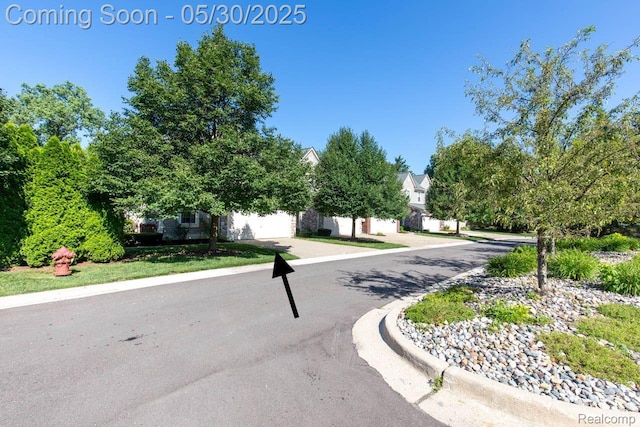 2062 Preserve Cir W, Canton, MI 48188 - view of asphalt street featuring curbs