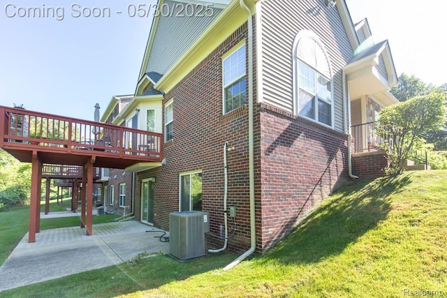 2062 Preserve Cir W, Canton, MI 48188 - view of side of home with a yard, a wooden deck, brick siding, and central air condition unit