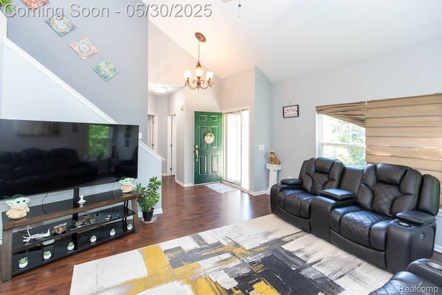 2062 Preserve Cir W, Canton, MI 48188 - living area featuring wood finished floors, a chandelier, baseboards, high vaulted ceiling, and stairway