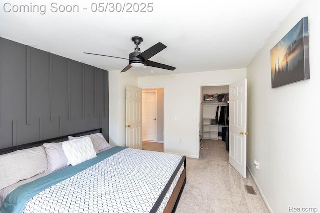 2062 Preserve Cir W, Canton, MI 48188 - bedroom featuring a spacious closet, light colored carpet, a closet, baseboards, and ceiling fan