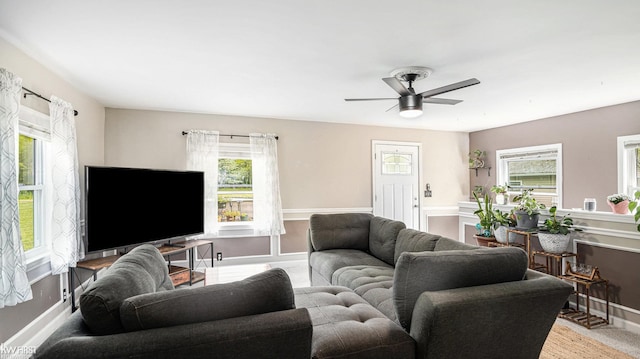 1590 W Rolston Rd, Linden, MI 48451 - living room with a ceiling fan and baseboards