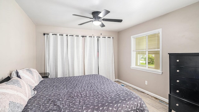 1590 W Rolston Rd, Linden, MI 48451 - bedroom with baseboards, light wood-style flooring, and a ceiling fan