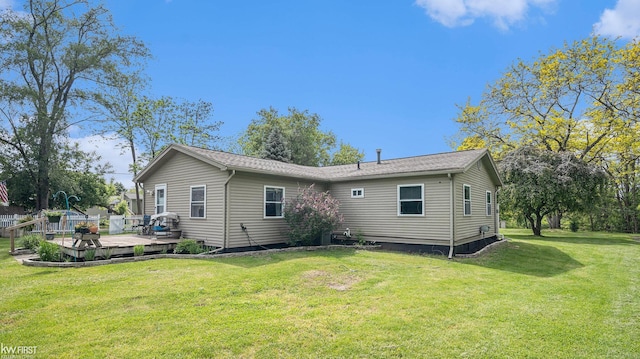 1590 W Rolston Rd, Linden, MI 48451 - back of property featuring a wooden deck and a lawn