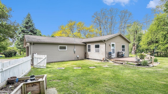 1590 W Rolston Rd, Linden, MI 48451 - rear view of house with a wooden deck and roof with shingles