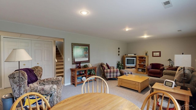 17 E Drake Dr, Saginaw, MI 48603 - living area featuring light colored carpet, stairway, and baseboards