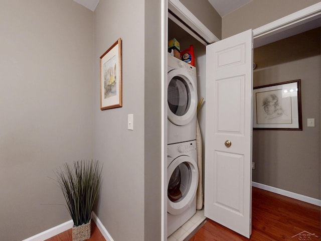 17 E Drake Dr, Saginaw, MI 48603 - laundry room with estacked washer and dryer, light wood-style floors, and baseboards