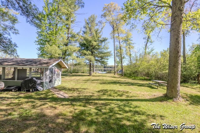 1261 W Channel St, Bitely, MI 49309 - view of grassy yard featuring a water view and an outdoor structure