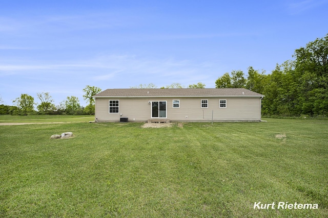 532 48th St, Grand Junction, MI 49056 - back of house featuring a yard, central AC, and entry steps