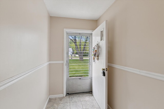 530 Manitou Rd, Saint Joseph, MI 49085 - doorway featuring baseboards and light tile patterned flooring