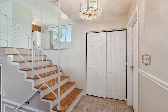 530 Manitou Rd, Saint Joseph, MI 49085 - stairway with baseboards and a chandelier