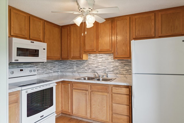 530 Manitou Rd, Saint Joseph, MI 49085 - kitchen with white appliances, a sink, light countertops, and tasteful backsplash