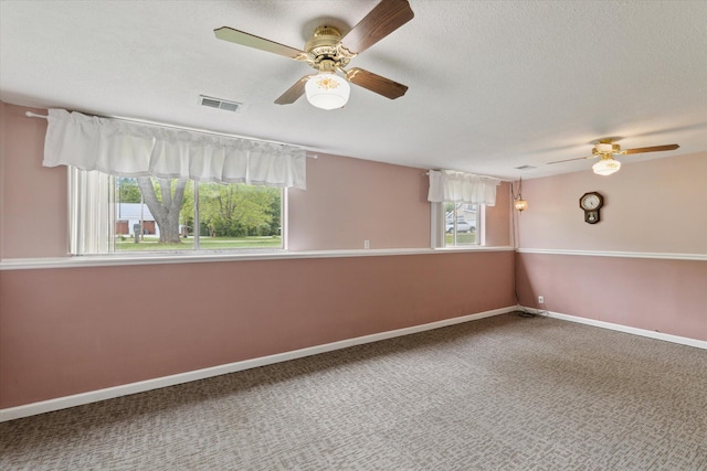 530 Manitou Rd, Saint Joseph, MI 49085 - spare room featuring ceiling fan, carpet, a textured ceiling, and baseboards