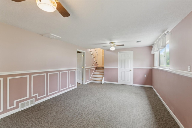 530 Manitou Rd, Saint Joseph, MI 49085 - carpeted empty room with a ceiling fan and stairway