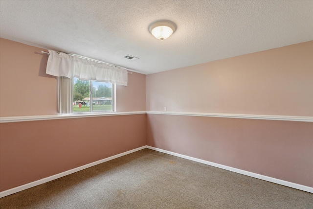 530 Manitou Rd, Saint Joseph, MI 49085 - spare room featuring carpet floors, baseboards, and a textured ceiling