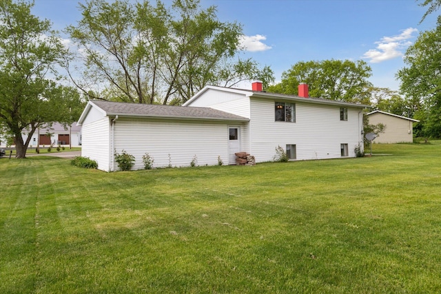 530 Manitou Rd, Saint Joseph, MI 49085 - rear view of property featuring a chimney and a yard