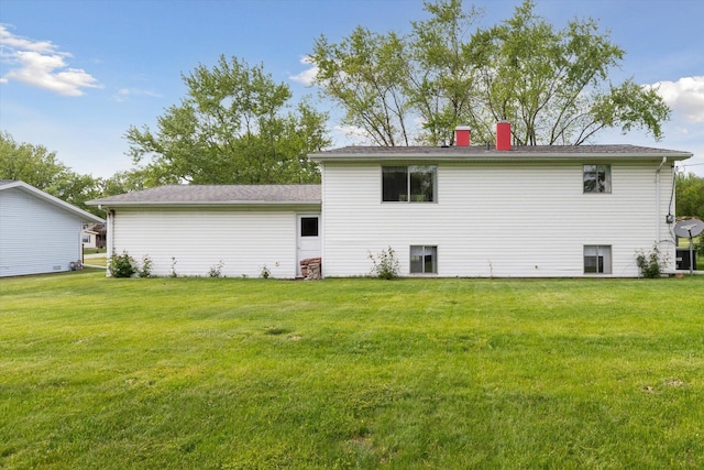 530 Manitou Rd, Saint Joseph, MI 49085 - back of house featuring a yard and a chimney