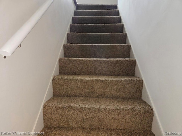 174 Hickory Dr, Troy, MI 48083 - stairs featuring carpet floors