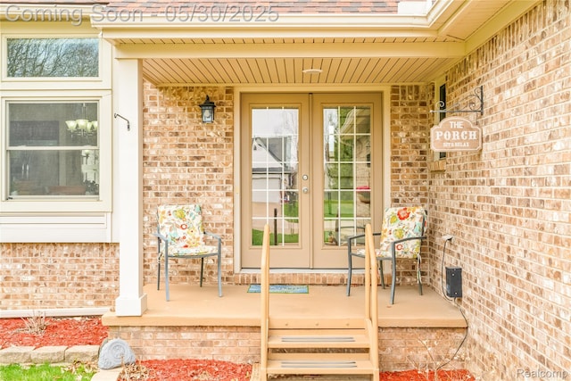 454 Breakwater, Belleville, MI 48111 - property entrance featuring brick siding, covered porch, and french doors