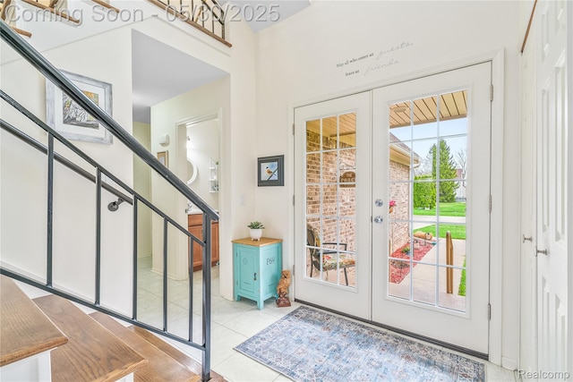 454 Breakwater, Belleville, MI 48111 - doorway to outside featuring french doors, stairway, and light tile patterned flooring