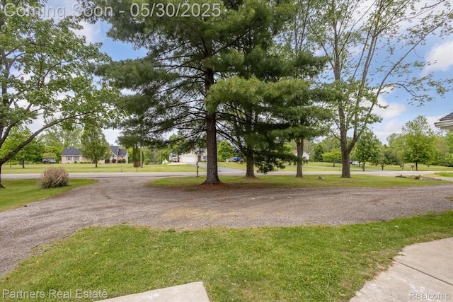 11651 Mason Rd, Webberville, MI 48892 - view of community with a yard