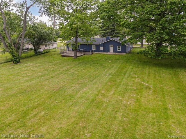 11651 Mason Rd, Webberville, MI 48892 - view of yard with a wooden deck