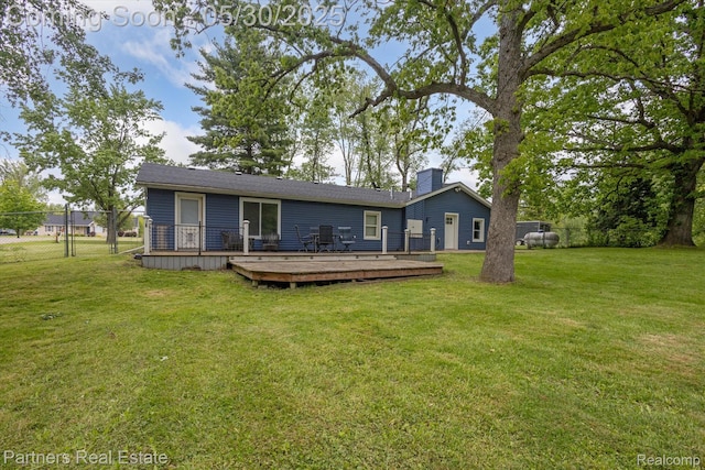 11651 Mason Rd, Webberville, MI 48892 - rear view of house with a wooden deck and a chimney