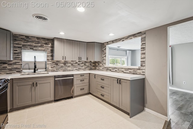 11651 Mason Rd, Webberville, MI 48892 - kitchen featuring stainless steel dishwasher, gray cabinets, a sink, backsplash, and recessed lighting