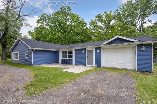 11651 Mason Rd, Webberville, MI 48892 - ranch-style house with a garage, driveway, a front lawn, and roof with shingles